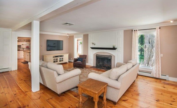 2 Ardsley Road Longmeadow, MA 01106 - Photo 6 of 30 a living room with furniture a flat screen tv and a fireplace
