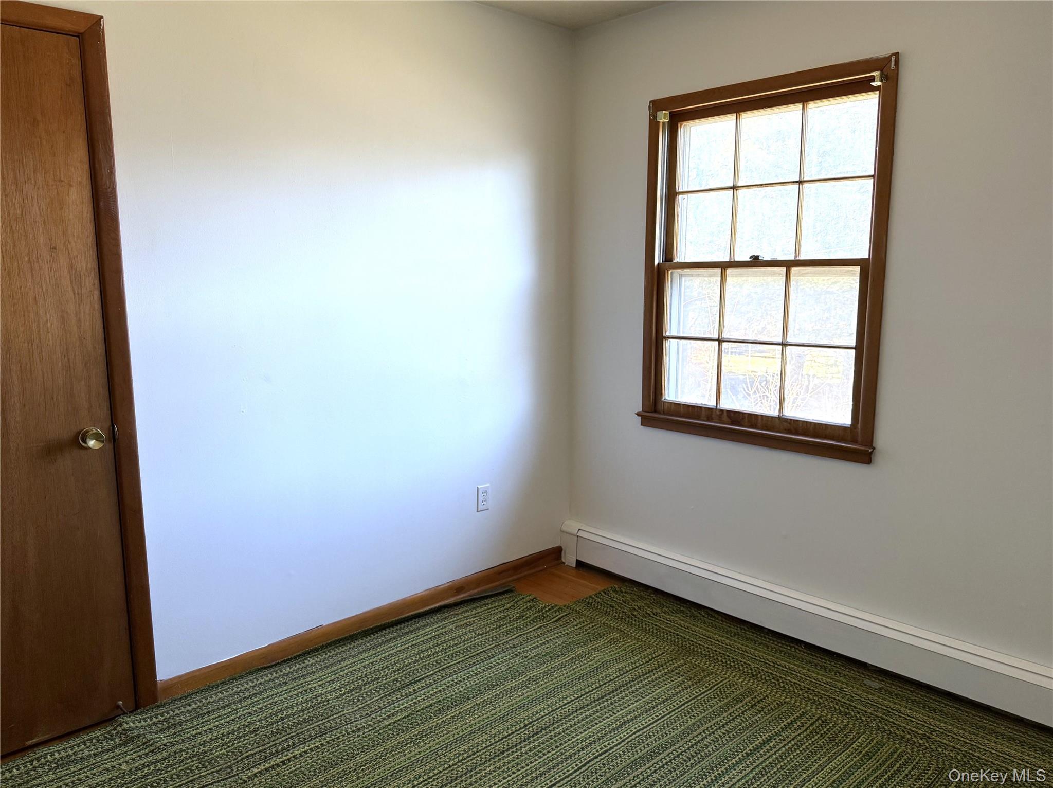 40 Walnut Street Pawling, NY 12564 - Photo 17 of 27 an empty room with wooden floor and windows