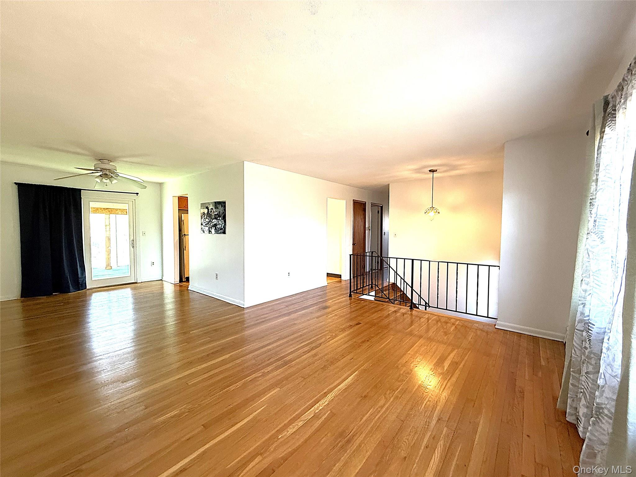 40 Walnut Street Pawling, NY 12564 - Photo 3 of 27 a view of an empty room with window and wooden floor