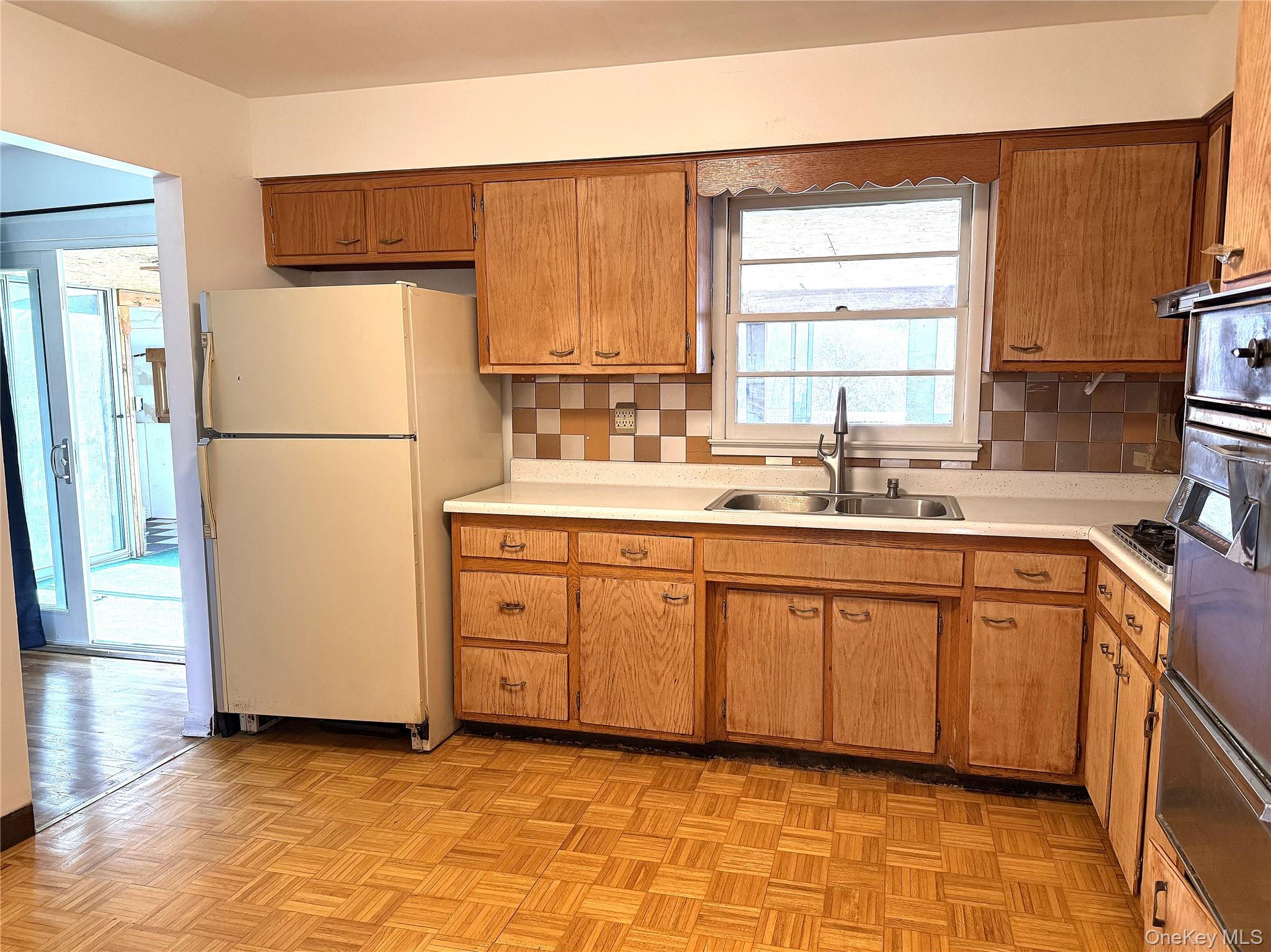 40 Walnut Street Pawling, NY 12564 - Photo 6 of 27 a kitchen with a sink cabinets and refrigerator