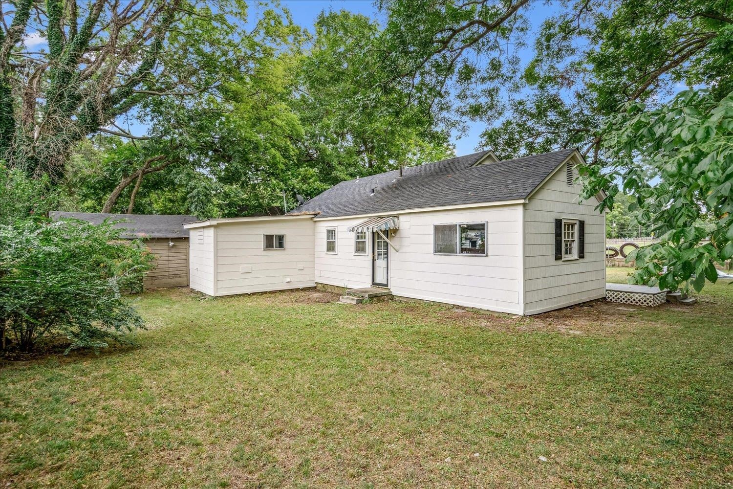 210 Kinney Avenue Covington, TN 38019 - Photo 27 of 28 a view of a house with a yard