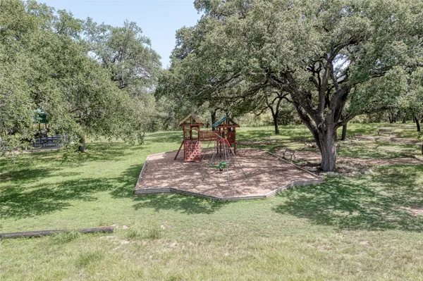 a view of a garden with trees