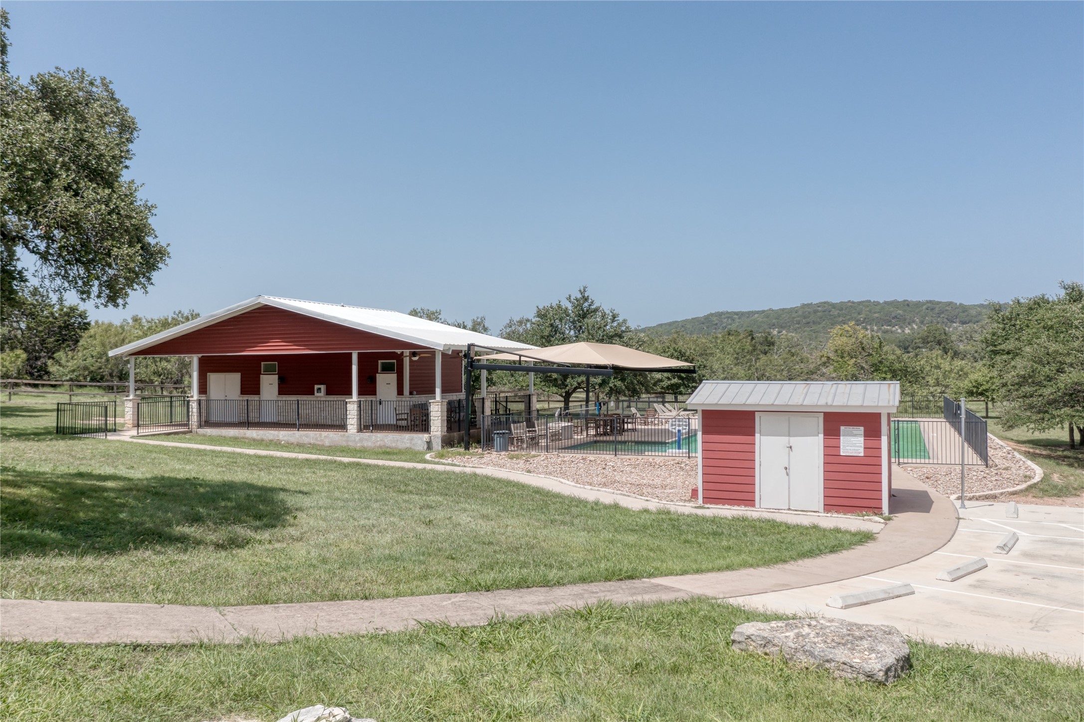 76 Balcones Ridge Way Bertram, TX 78605 - Photo 14 of 15 a front view of a house with a yard