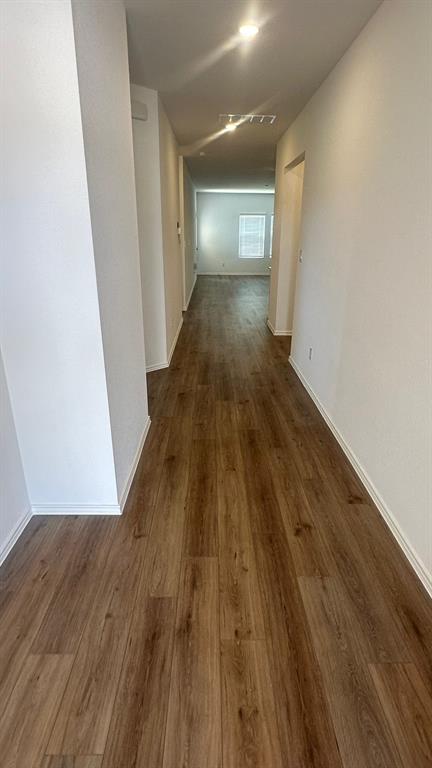 192 Rodney Boat Road Kyle, TX 78640 - Photo 3 of 38 An inviting hallway with gleaming wood flooring creates a warm entry.