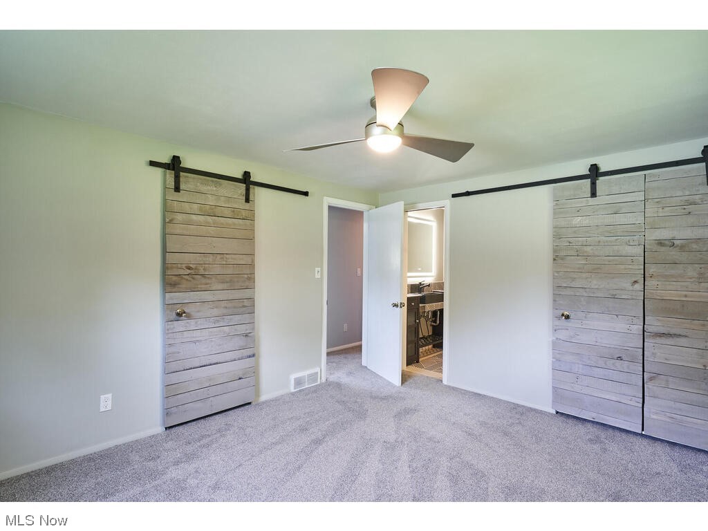 2122 Springfield Center Road Akron, OH 44312 - Photo 12 of 28 Sliding doors to closet and full Master Bath