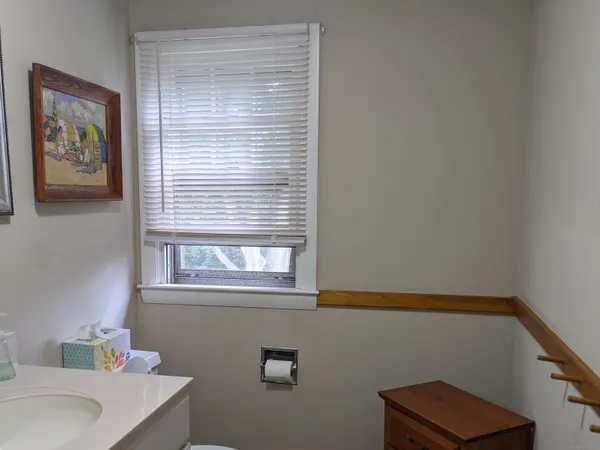 a bathroom with a sink and a window