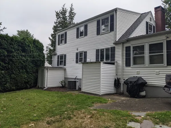a view of a house with a yard