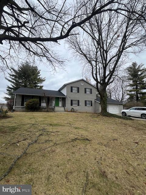 10038 Pleasant View Drive Hagerstown, MD 21740 - Photo 1 of 28 a front view of a house with a yard
