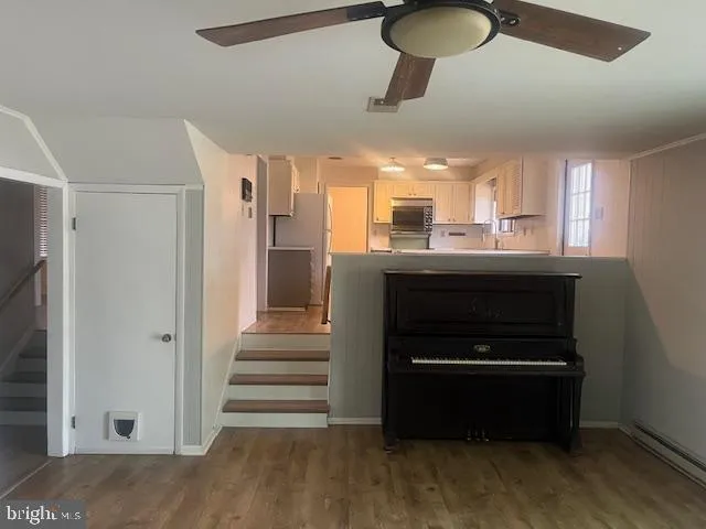 a kitchen with stainless steel appliances granite countertop a stove and a refrigerator