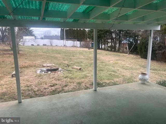 a view of a backyard of the house