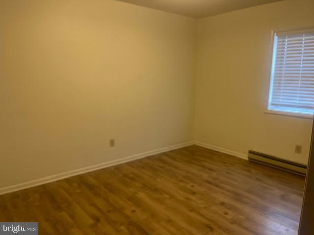 10038 Pleasant View Drive Hagerstown, MD 21740 - Photo 16 of 28 a view of an empty room with wooden floor and a window