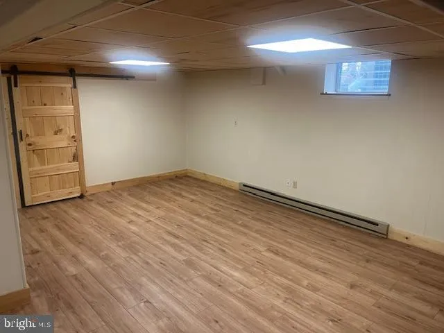 an empty room with wooden floor