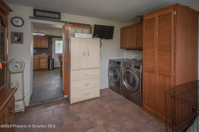 a utility room with dryer and washer
