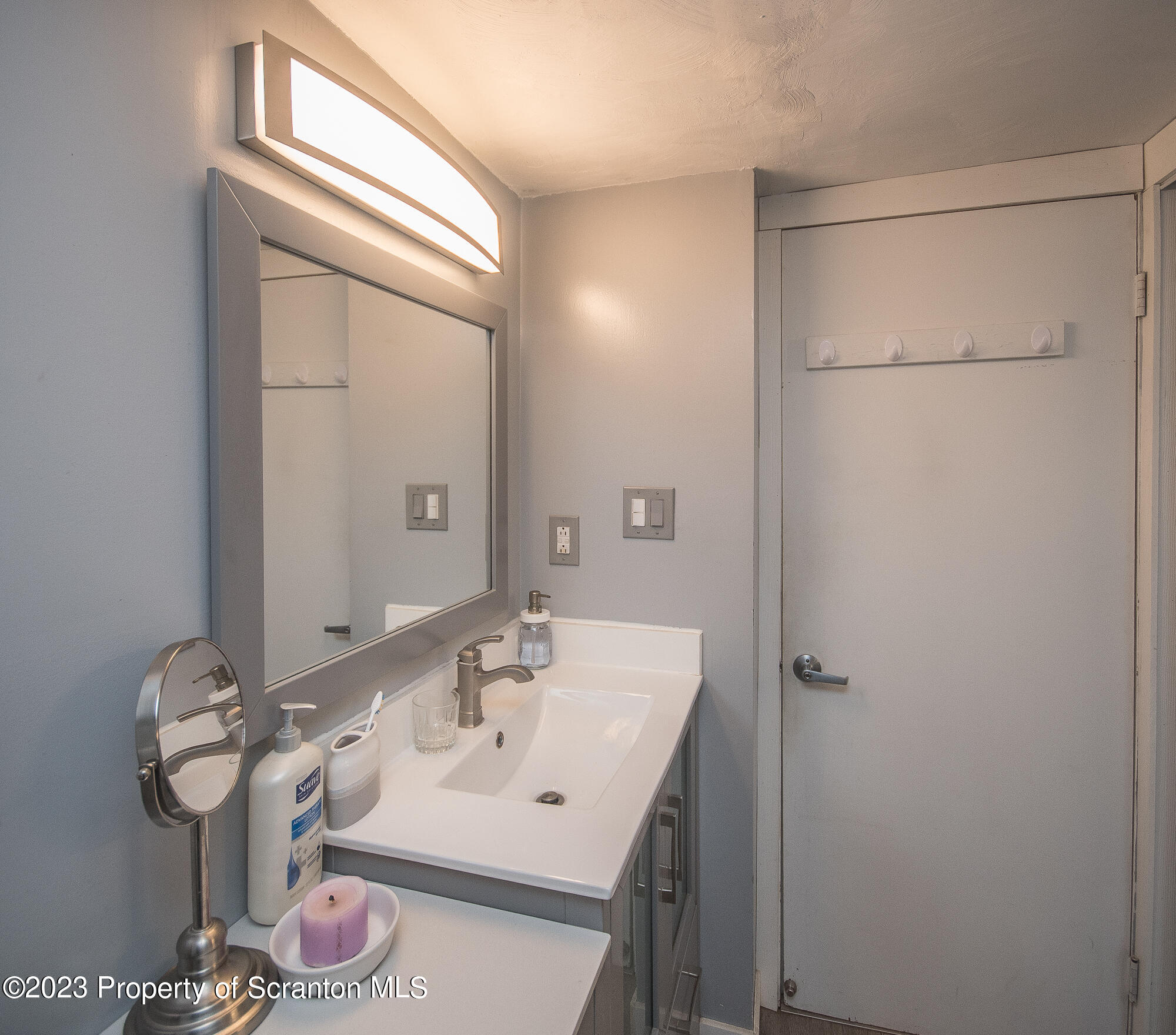776 Milanville Road Beach Lake, PA 18405 - Photo 8 of 28 a bathroom with a sink and a mirror