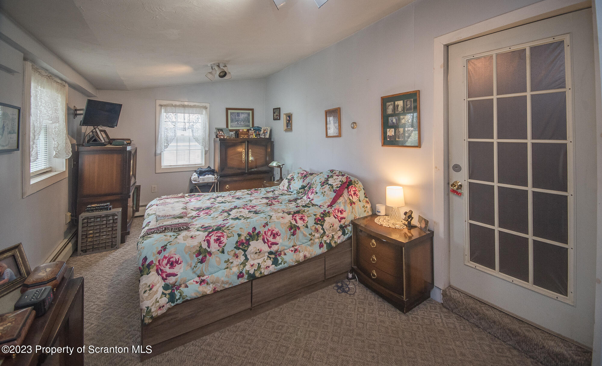 776 Milanville Road Beach Lake, PA 18405 - Photo 9 of 28 a bedroom with a bed and a window in it