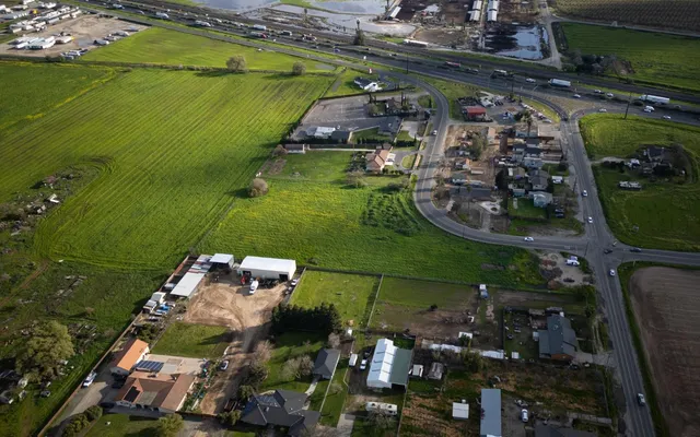 an aerial view of a houses with a lake view