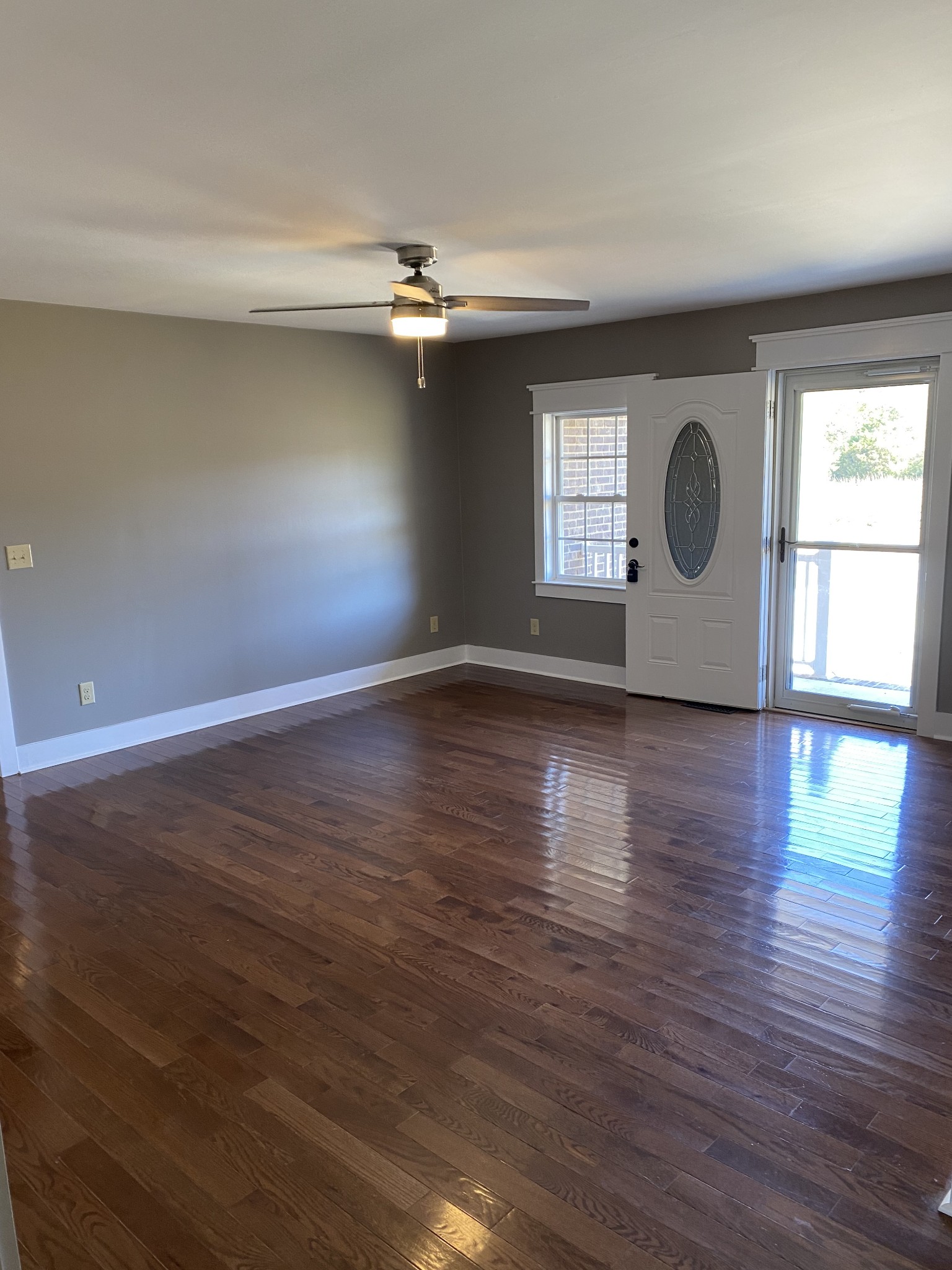 1513 Normandy Road Normandy, TN 37360 - Photo 5 of 29 an empty room with wooden floor and windows