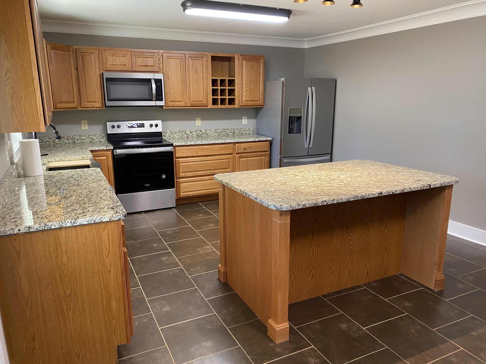 1513 Normandy Road Normandy, TN 37360 - Photo 6 of 29 a kitchen with stainless steel appliances granite countertop a sink stove and microwave