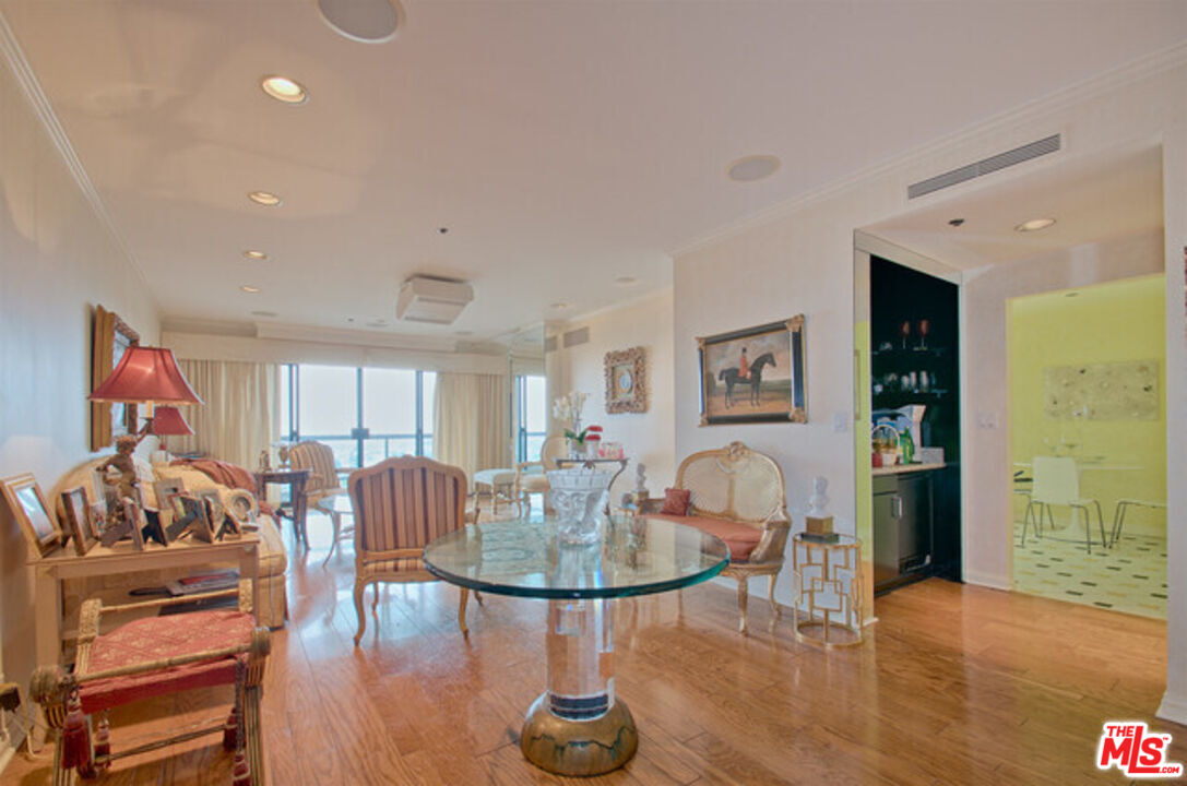 10724 Wilshire Boulevard, Unit 1001 Los Angeles, CA 90024 - Photo 11 of 20 a living room with furniture and wooden floor