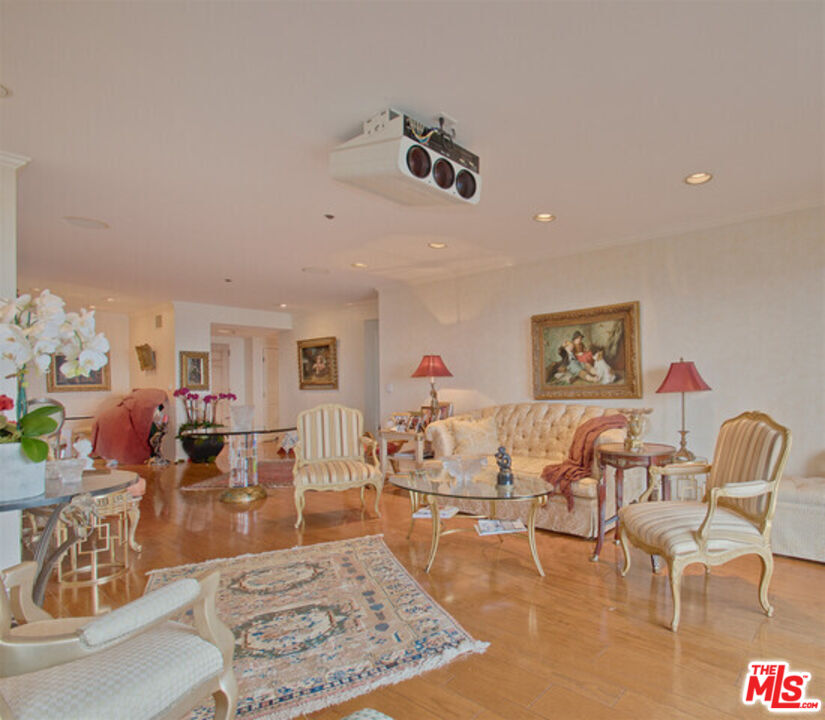 10724 Wilshire Boulevard, Unit 1001 Los Angeles, CA 90024 - Photo 12 of 20 a living room with furniture and a wooden floor