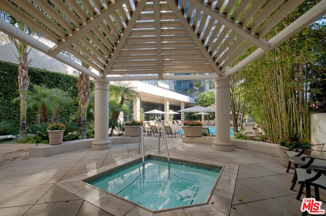 a view of a swimming pool with a patio