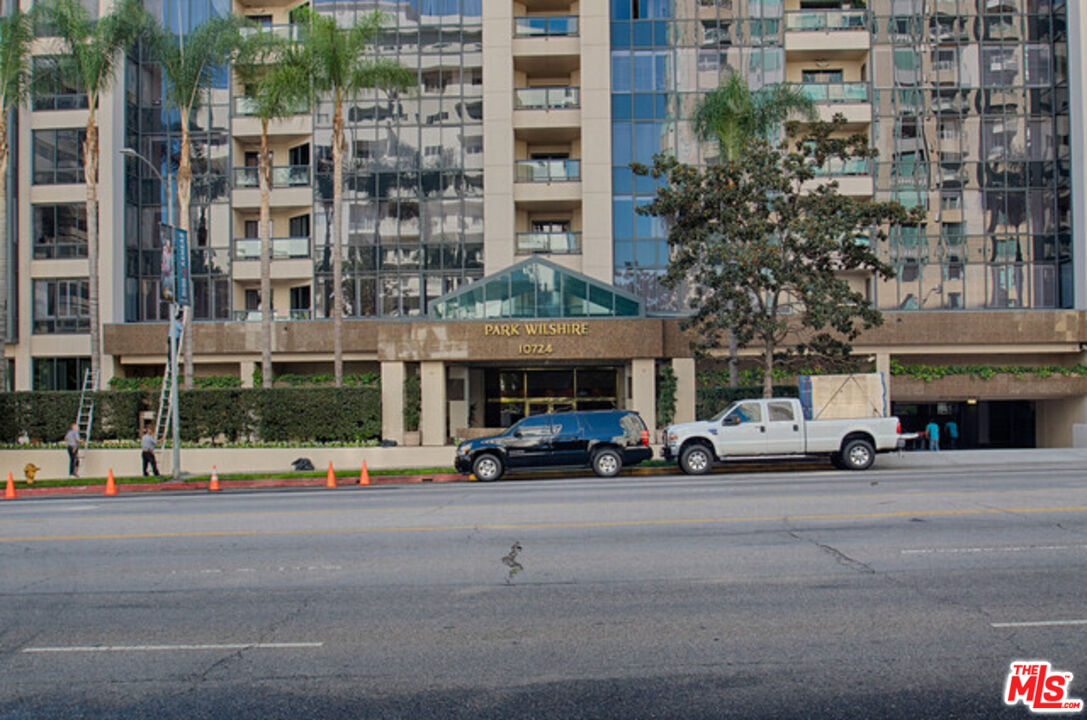 10724 Wilshire Boulevard, Unit 1001 Los Angeles, CA 90024 - Photo 2 of 20 a view of a street with cars and traffic signal