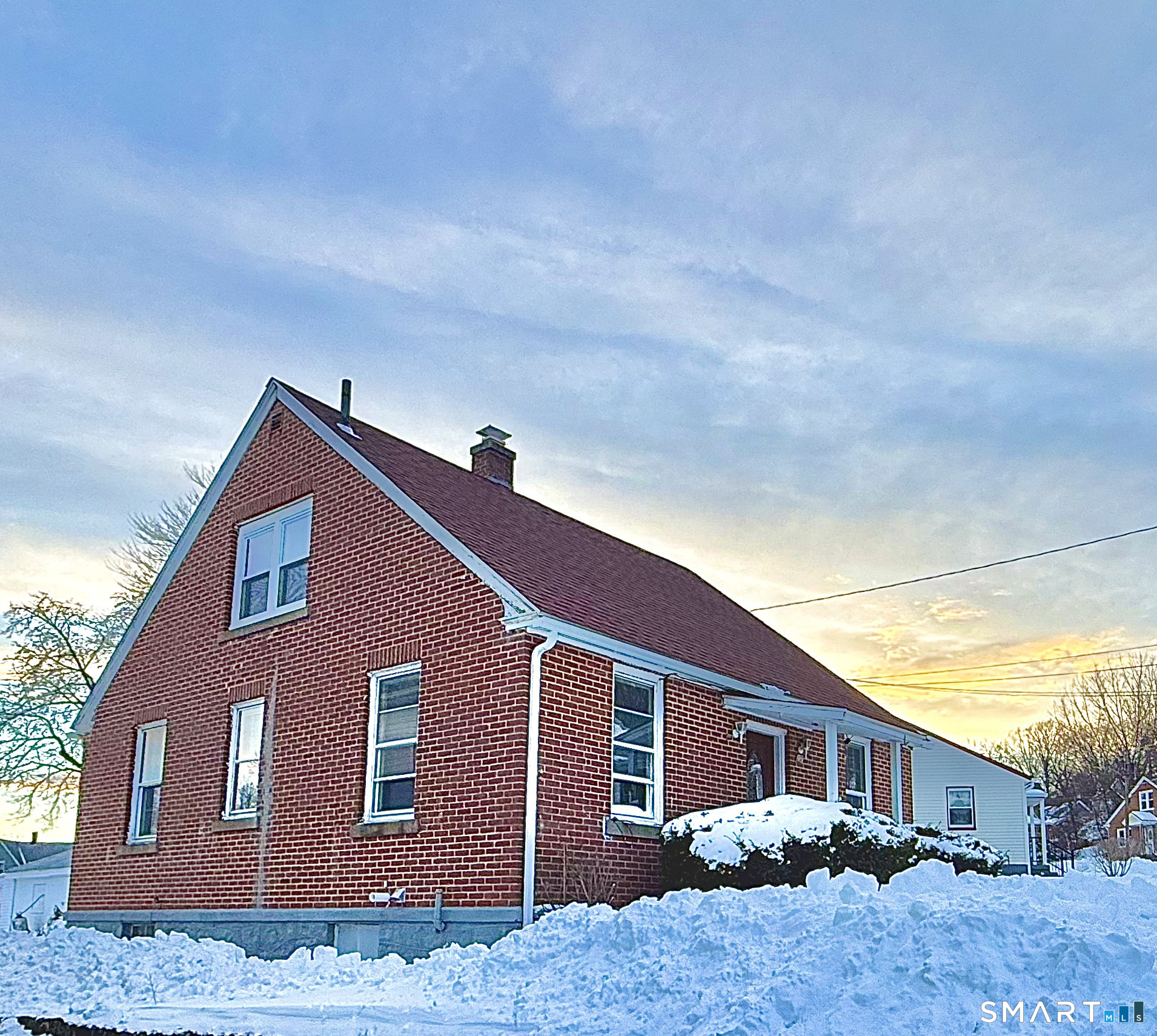 a front view of a house with yard