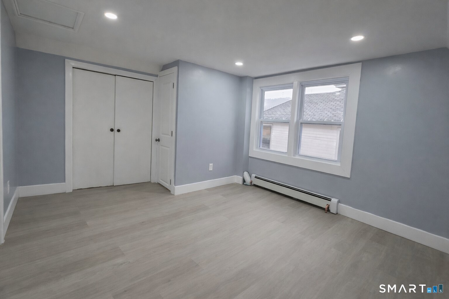 212 Platt Street Waterbury, CT 06704 - Photo 12 of 23 an empty room with windows