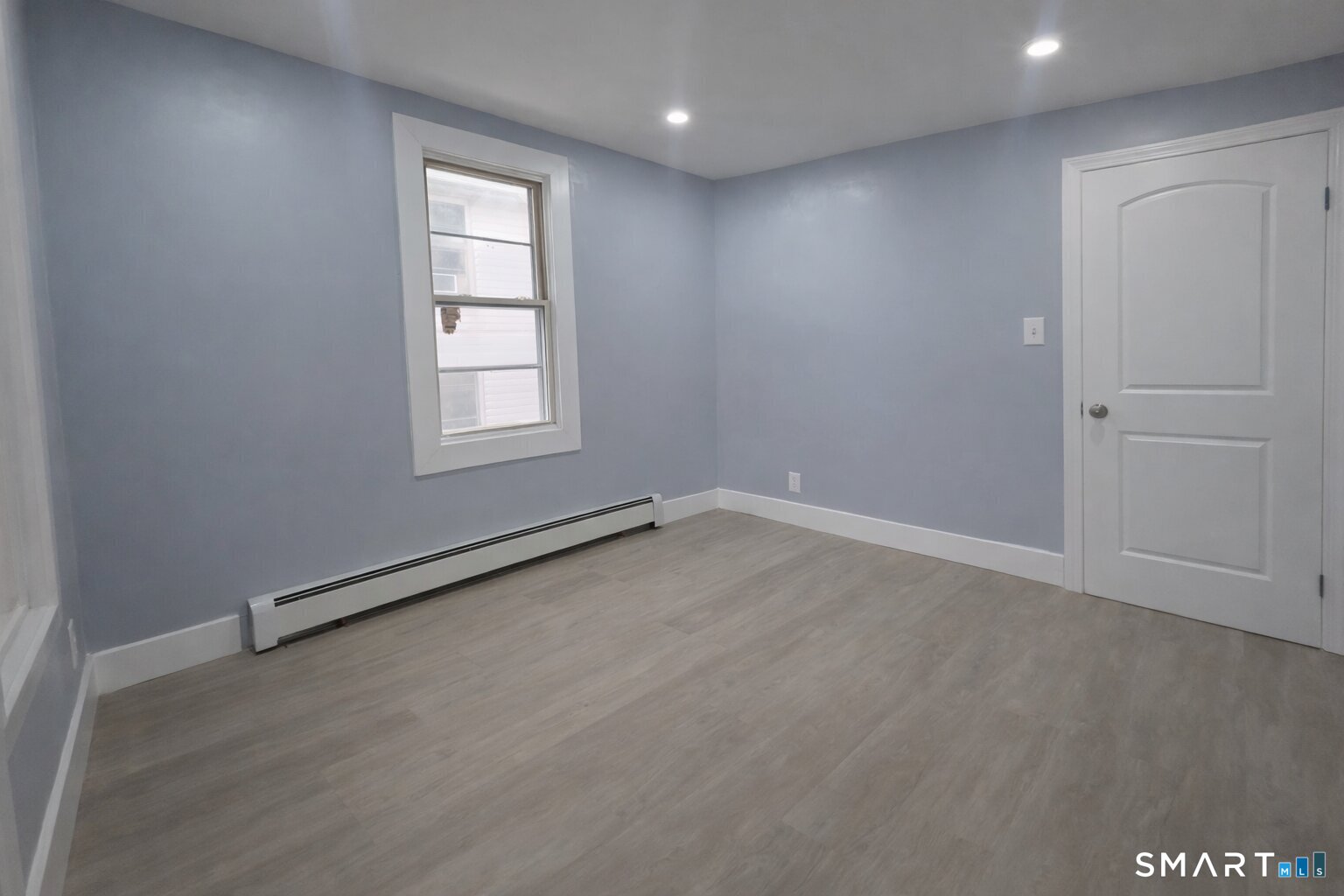 212 Platt Street Waterbury, CT 06704 - Photo 16 of 23 an empty room with windows