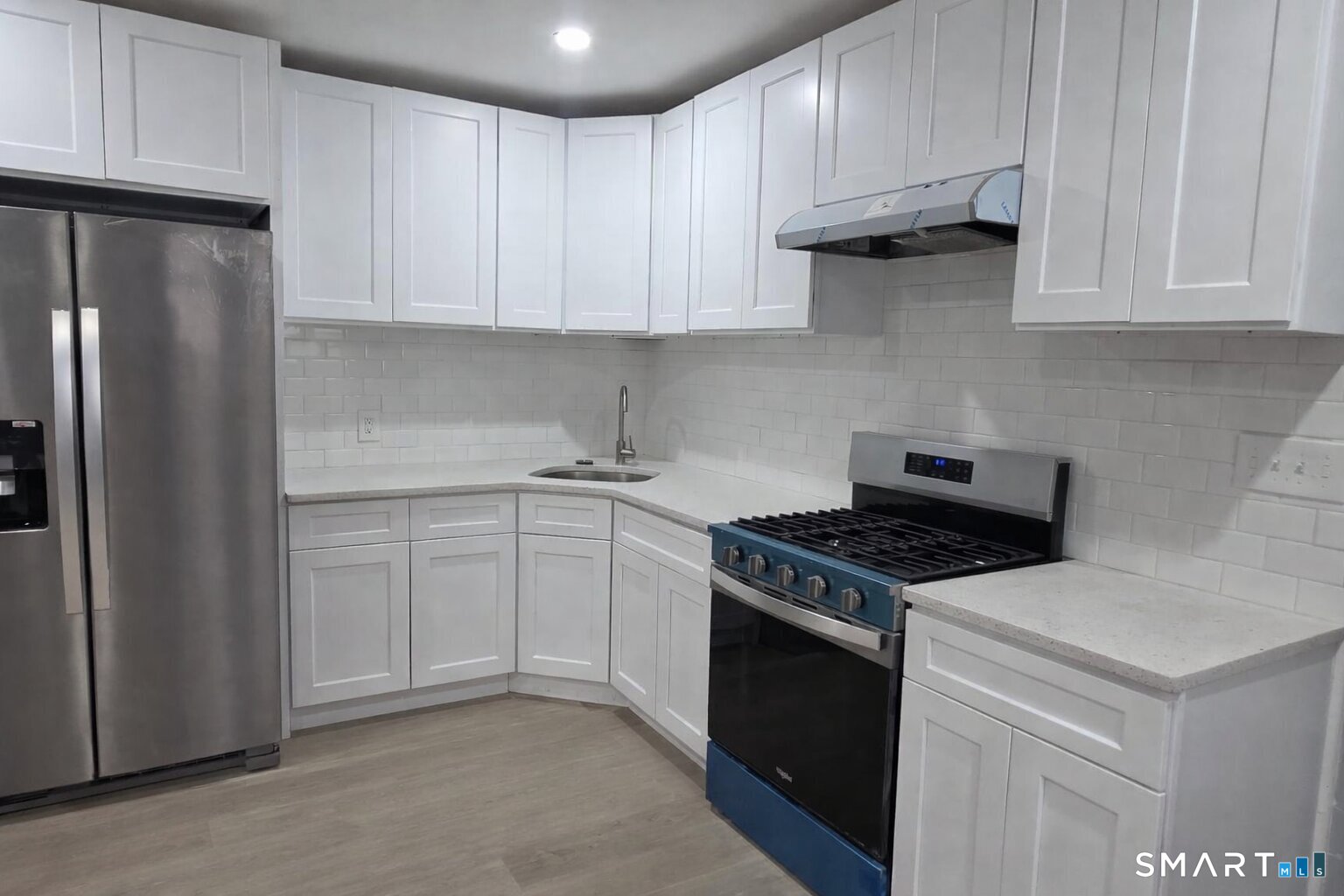 212 Platt Street Waterbury, CT 06704 - Photo 19 of 27 a kitchen with cabinets appliances and a counter space