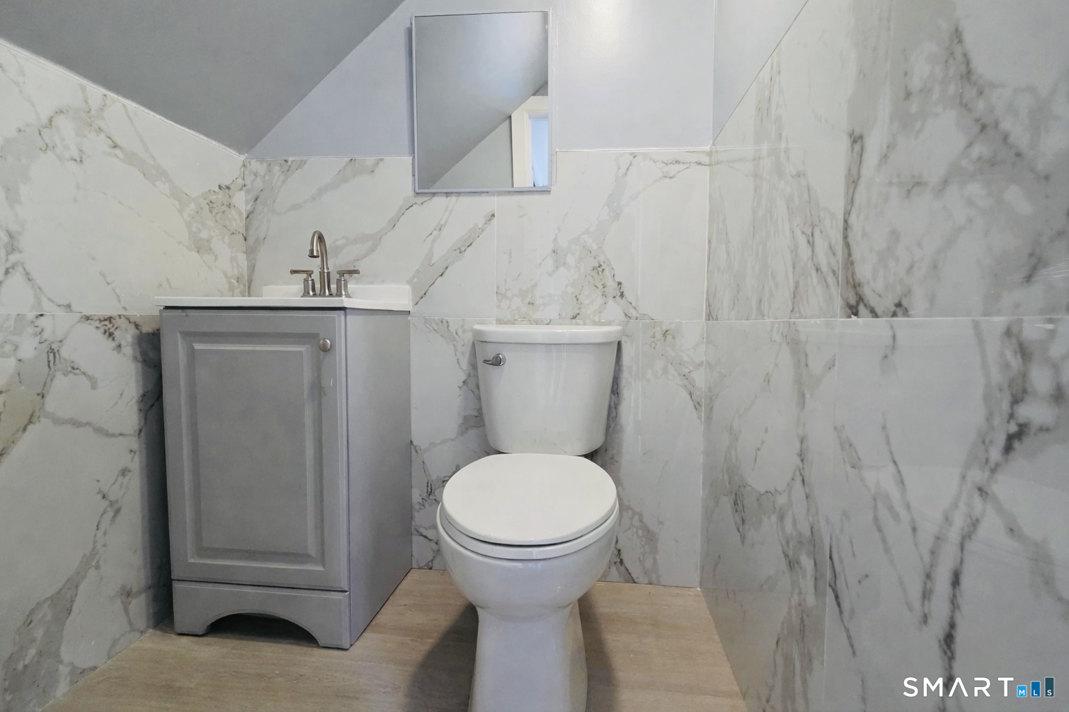 212 Platt Street Waterbury, CT 06704 - Photo 9 of 27 a bathroom with a sink and a toilet