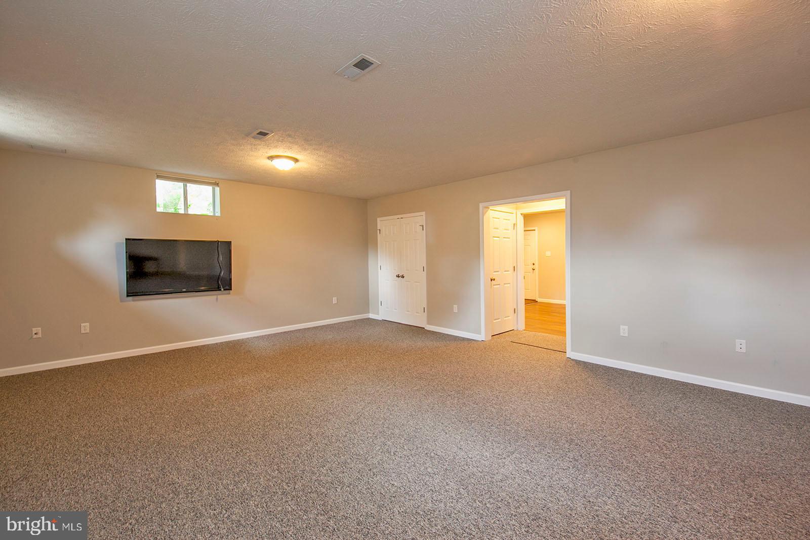103 Longcroft Road Winchester, VA 22602 - Photo 33 of 52 New carpet in lower level family room