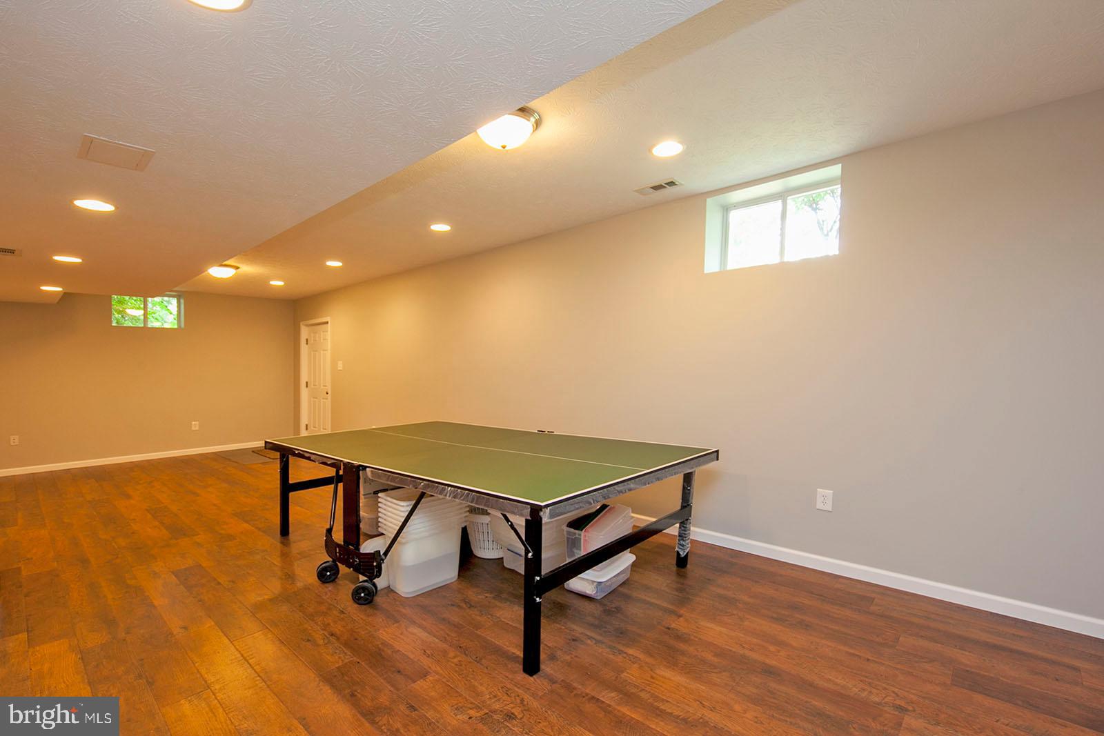 103 Longcroft Road Winchester, VA 22602 - Photo 36 of 52 Large rec room with new laminate flooring
