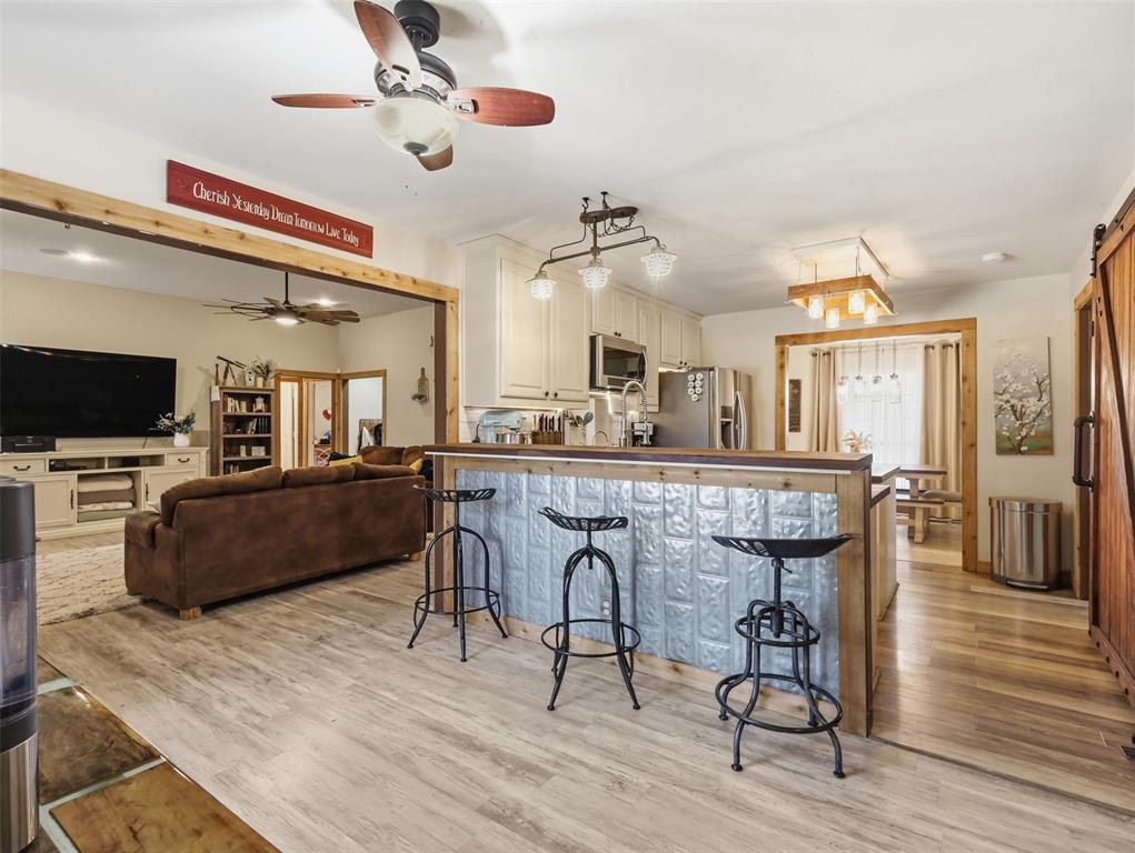 3823 State Highway Bonham, TX 75418 - Photo 17 of 37 a view of a dining room with furniture and wooden floor