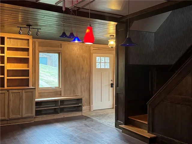 a bathroom with a sink mirror vanity and toilet