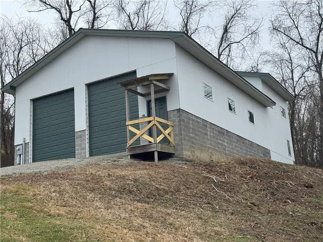 a kitchen with a sink a counter top space and stainless steel appliances