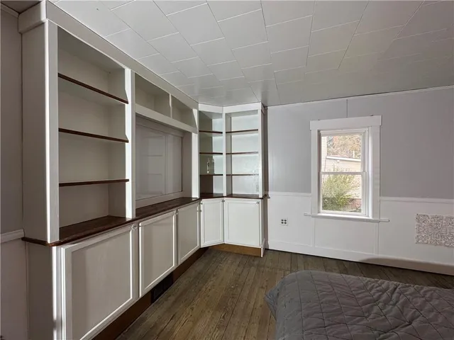 a bathroom with a sink a toilet a shower and a mirror