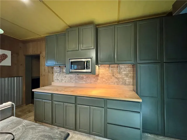 a view of a tables and chairs in the room