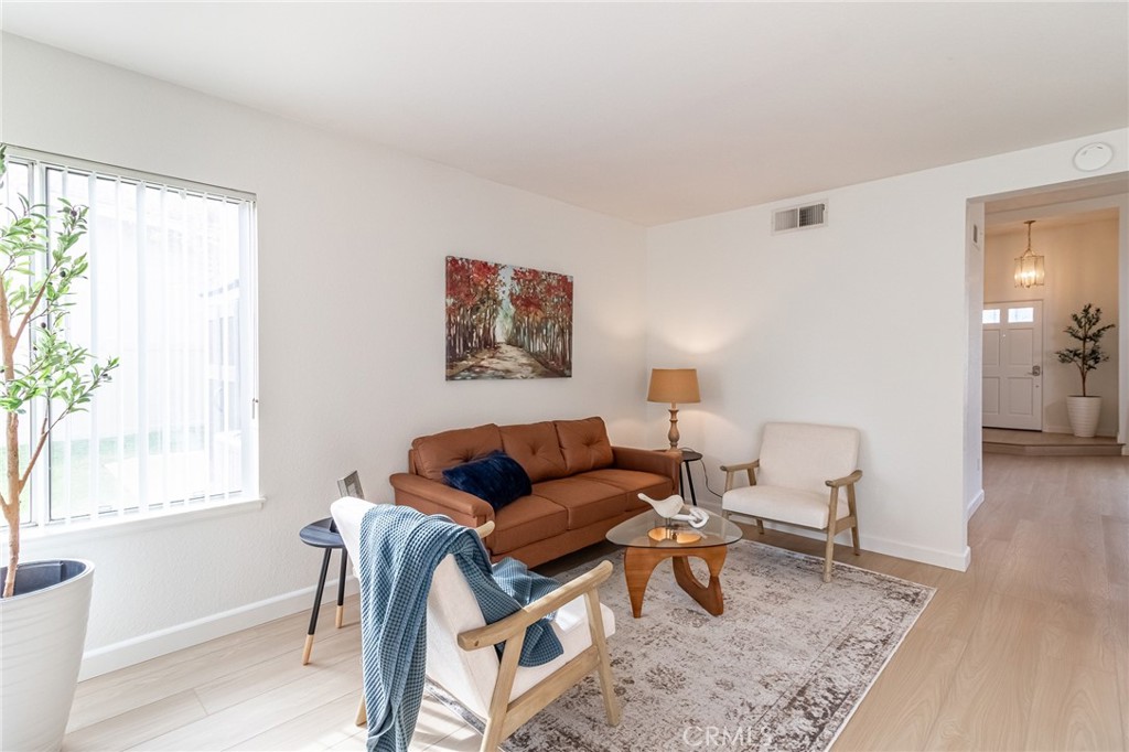 7529 Hardy Avenue Rancho Cucamonga, CA 91730 - Photo 11 of 38 a living room with furniture and a window