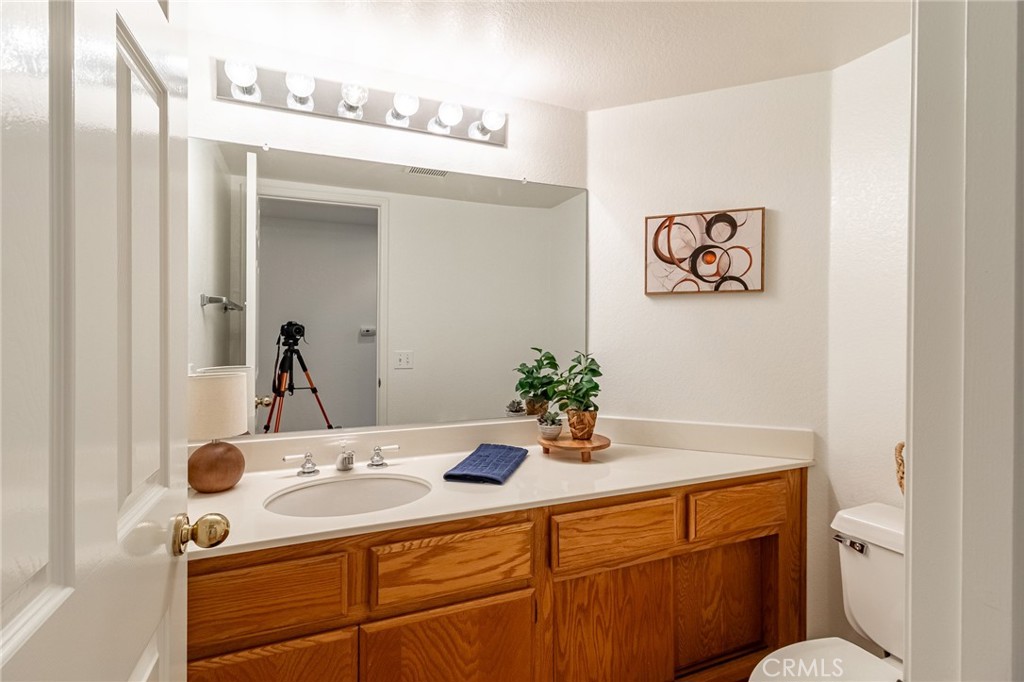 7529 Hardy Avenue Rancho Cucamonga, CA 91730 - Photo 16 of 38 a bathroom with a sink mirror and vanity