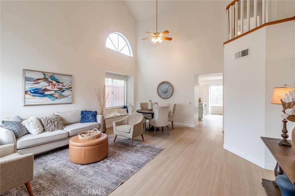 7529 Hardy Avenue Rancho Cucamonga, CA 91730 - Photo 3 of 38 a living room with furniture a rug and a window