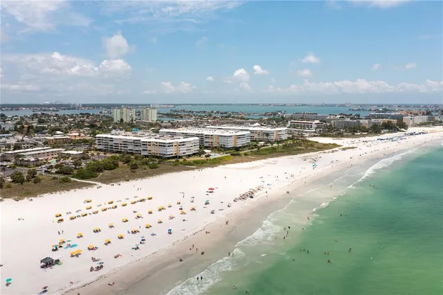 an aerial view of a houses with a lake view