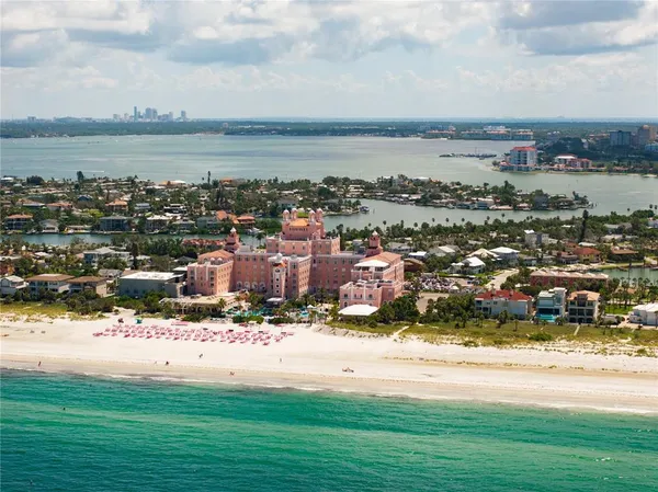 a view of a livingroom with furniture and a window
