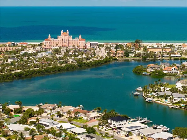a view of a lake with couches in the patio