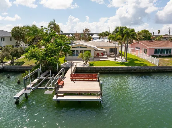 a view of a balcony with two chairs and a table
