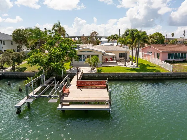 a view of a balcony with two chairs and a table