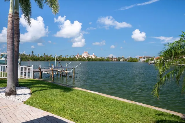 a kitchen that has a lot of cabinets in it and appliances