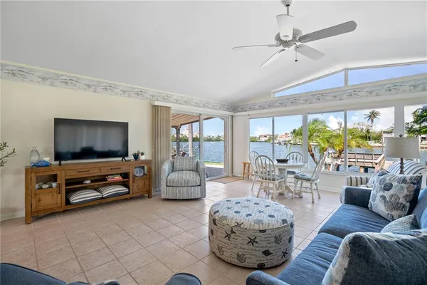 a kitchen with a refrigerator a stove a sink and dishwasher with wooden floor