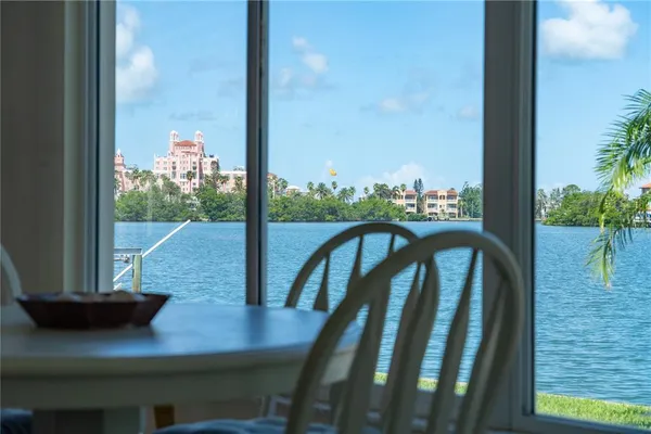 a bedroom with a bed and large window
