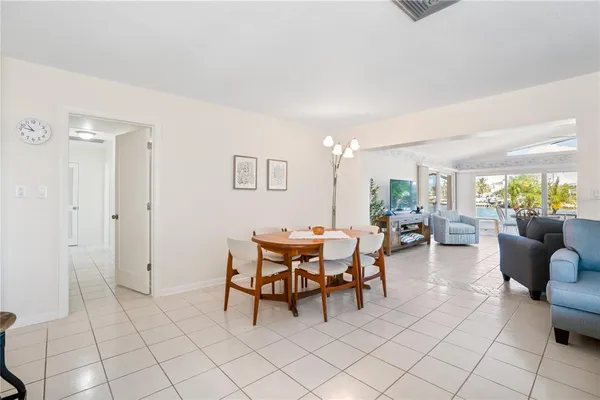 a bathroom with a sink vanity granite tub shower and a mirror